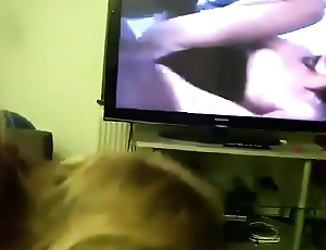 Maw gives son head while he watches porn
